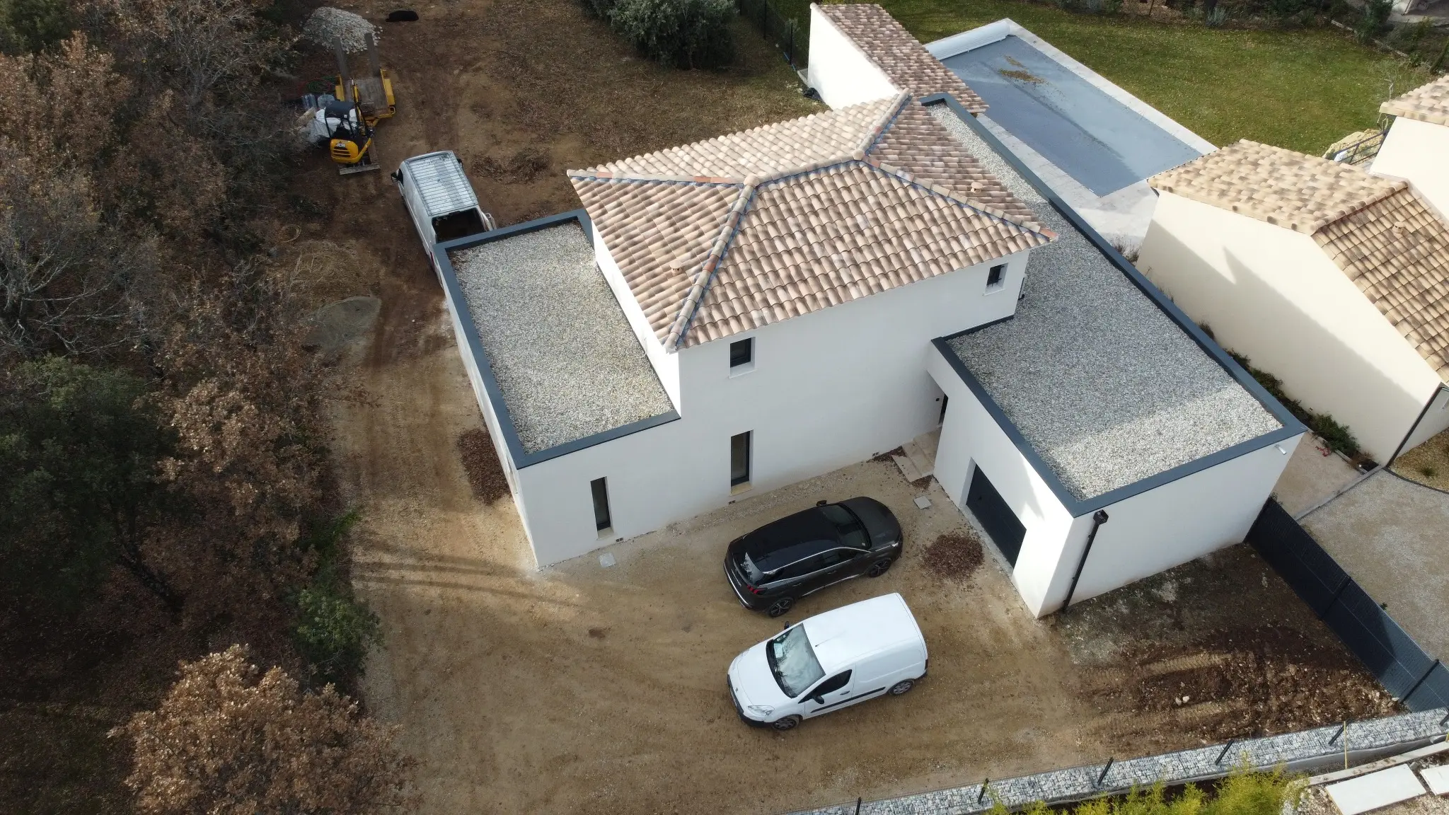 Vue arrière d’une construction de maison individuelle à Venasque